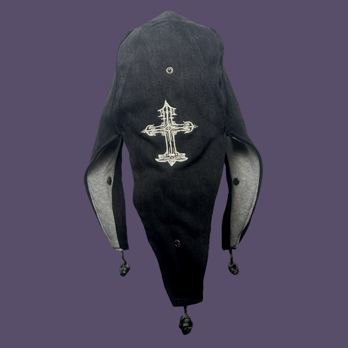Faded black jester coffin cap