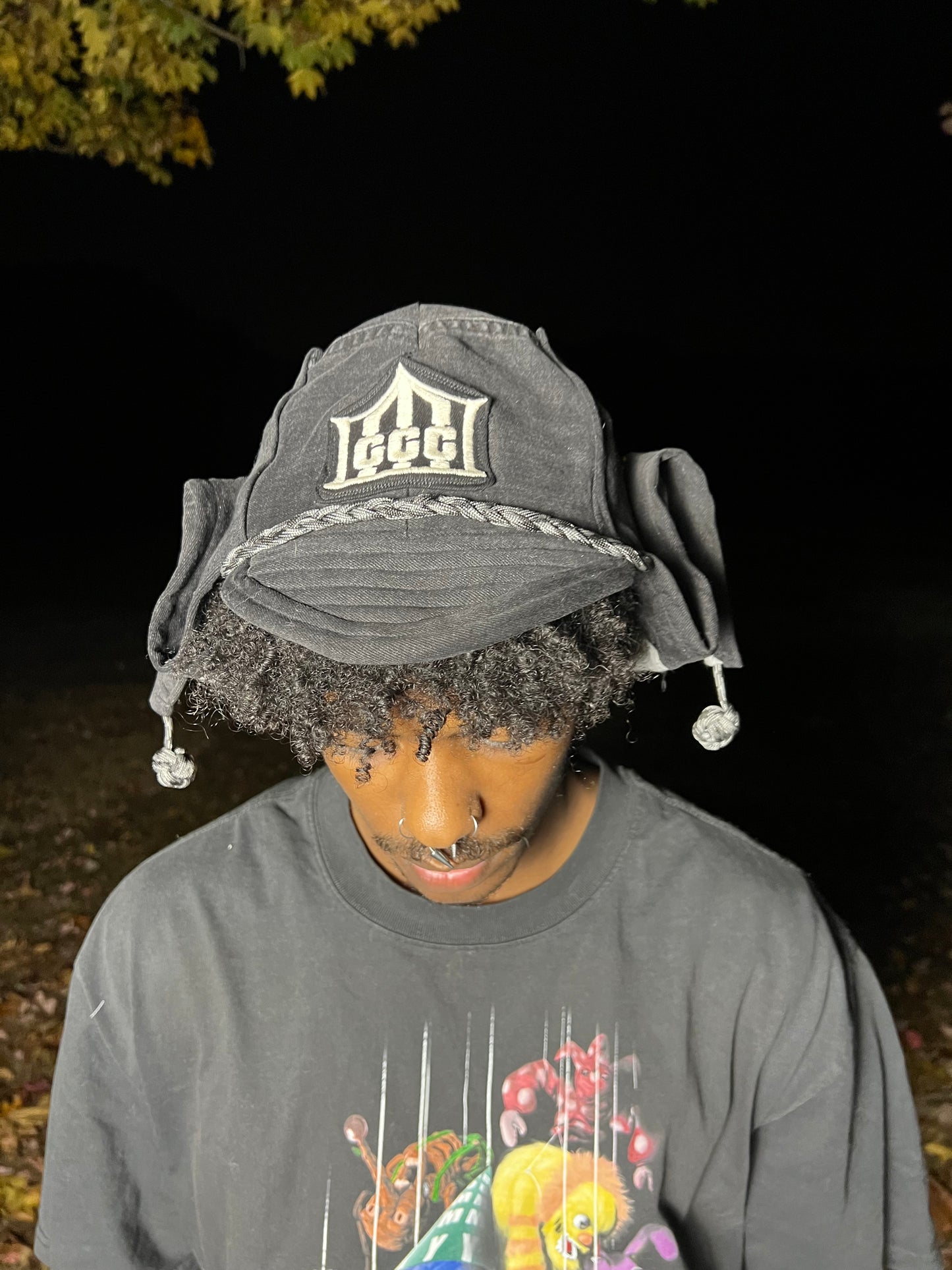 Faded black jester coffin cap