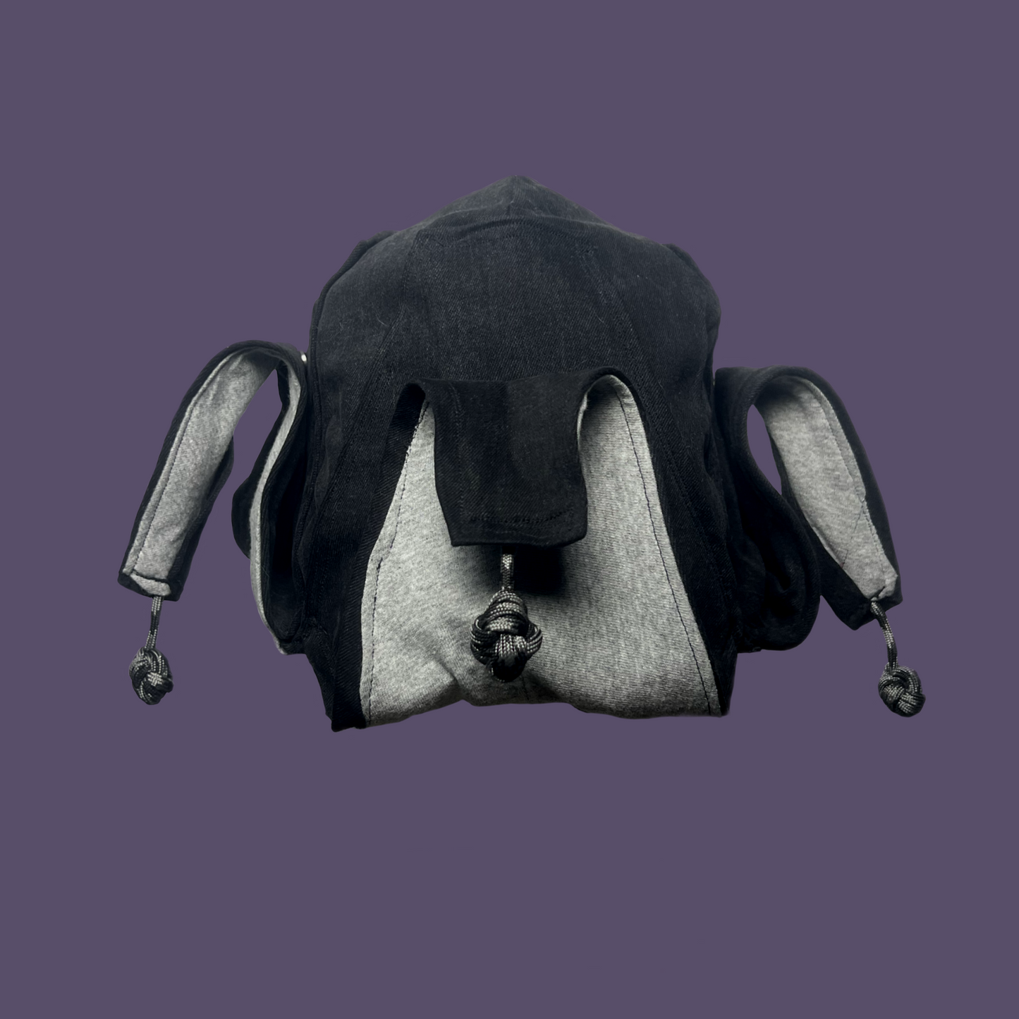 Faded black jester coffin cap